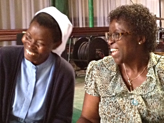 Jeanne d'Arc Uwurukundo from the Servants of Christ order and The Outreach Foundation's Projects Coordinator, Ebralie Mwizerwa