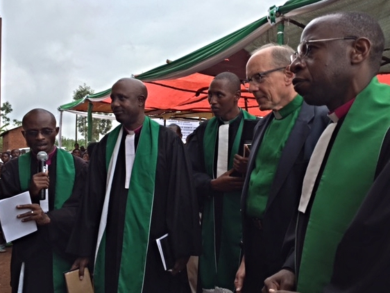 Rob and Rwandan pastors preparing to cut the ribbon and enter the Karangara Church