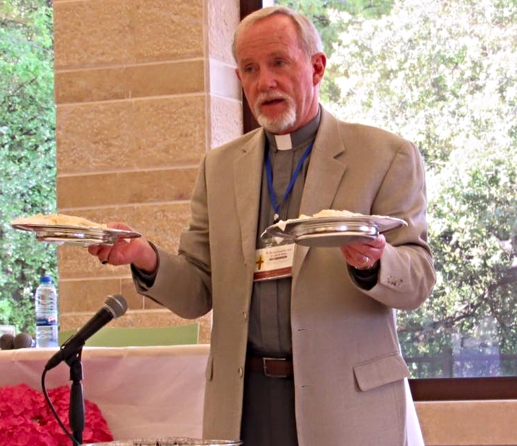Rev. Tim McCalmont offering Christ’s body broken for us at the communion service.