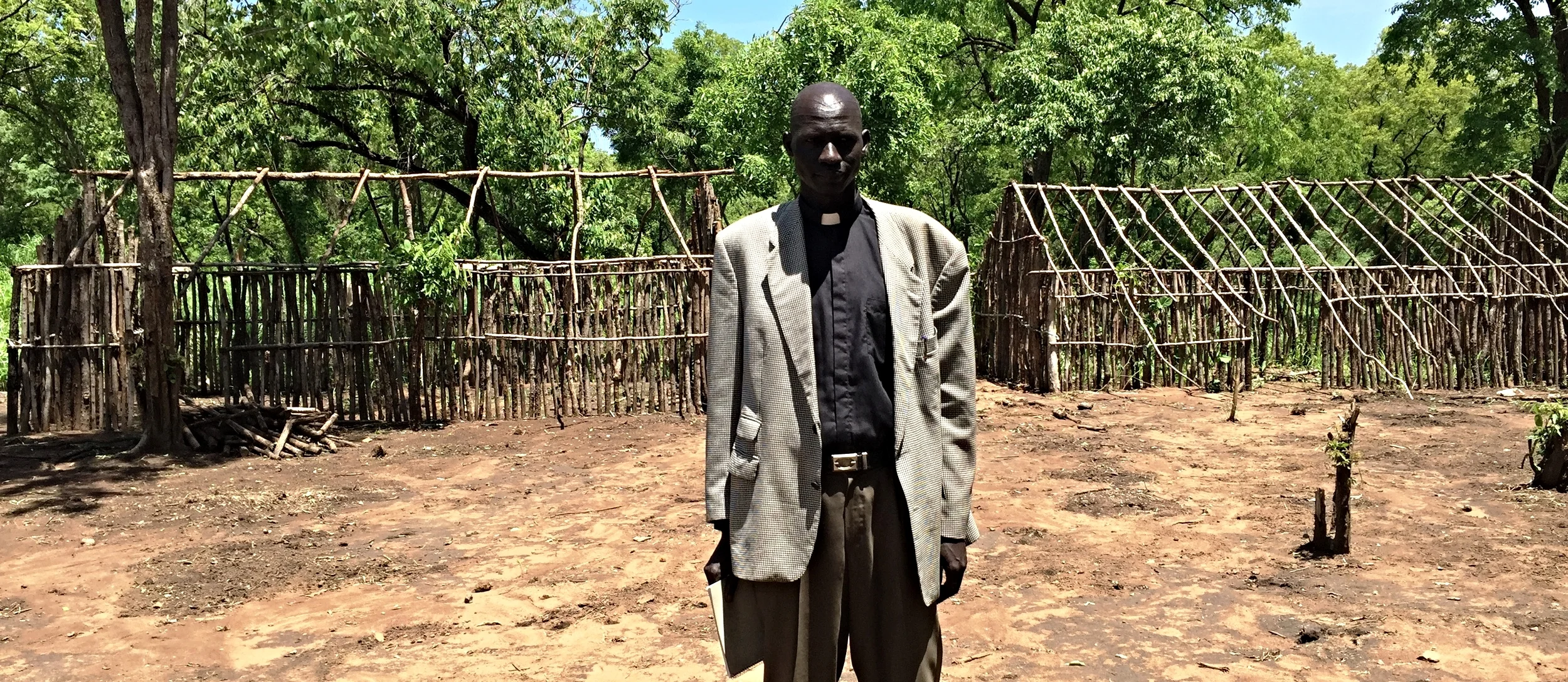 Pastor Steven in front of future preschool classrooms for children.