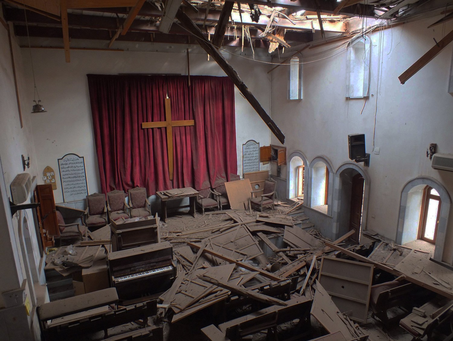 The photo was taken from from the balcony of the Presbyterian Church in Homs, Syria, after it sustained a rocket or mortar attack.