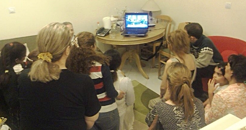 An actual house church in Iran gathered around a laptop watching the show that is depicted in the photo below.