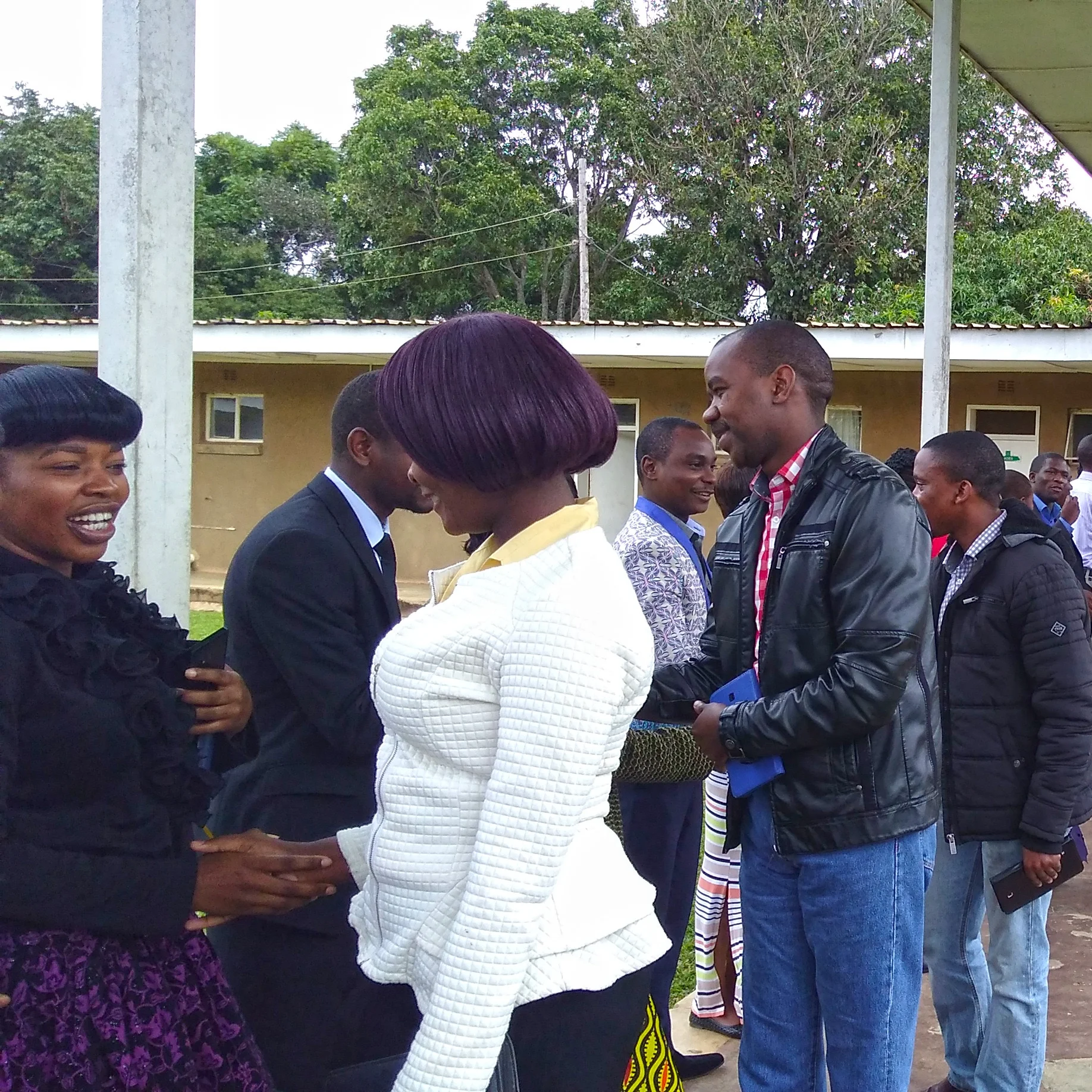Justo Mwale theological students shaking hands and enjoying fellowship after Friday morning chapel.