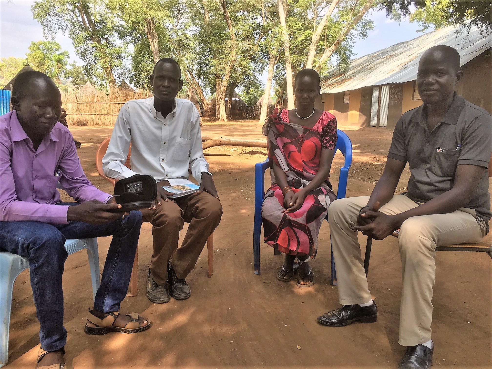  John Jock demonstrating the Audio device with the recorded trauma healing lessons, new testament and devotions in Nuer 