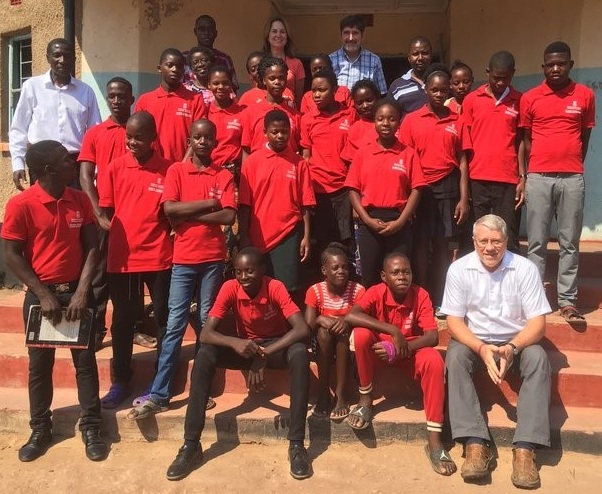 An Outreach team including Frank Dimmock, Ted and Sue Wright, Jennifer L. Ellis and Ebralie Mwizerwa traveled to Siavonga in September to visit the children and meet the Namumu Board of Management. Pictured here with the team and children are Namumu board members including Board Chair Leonard Hachitapika.