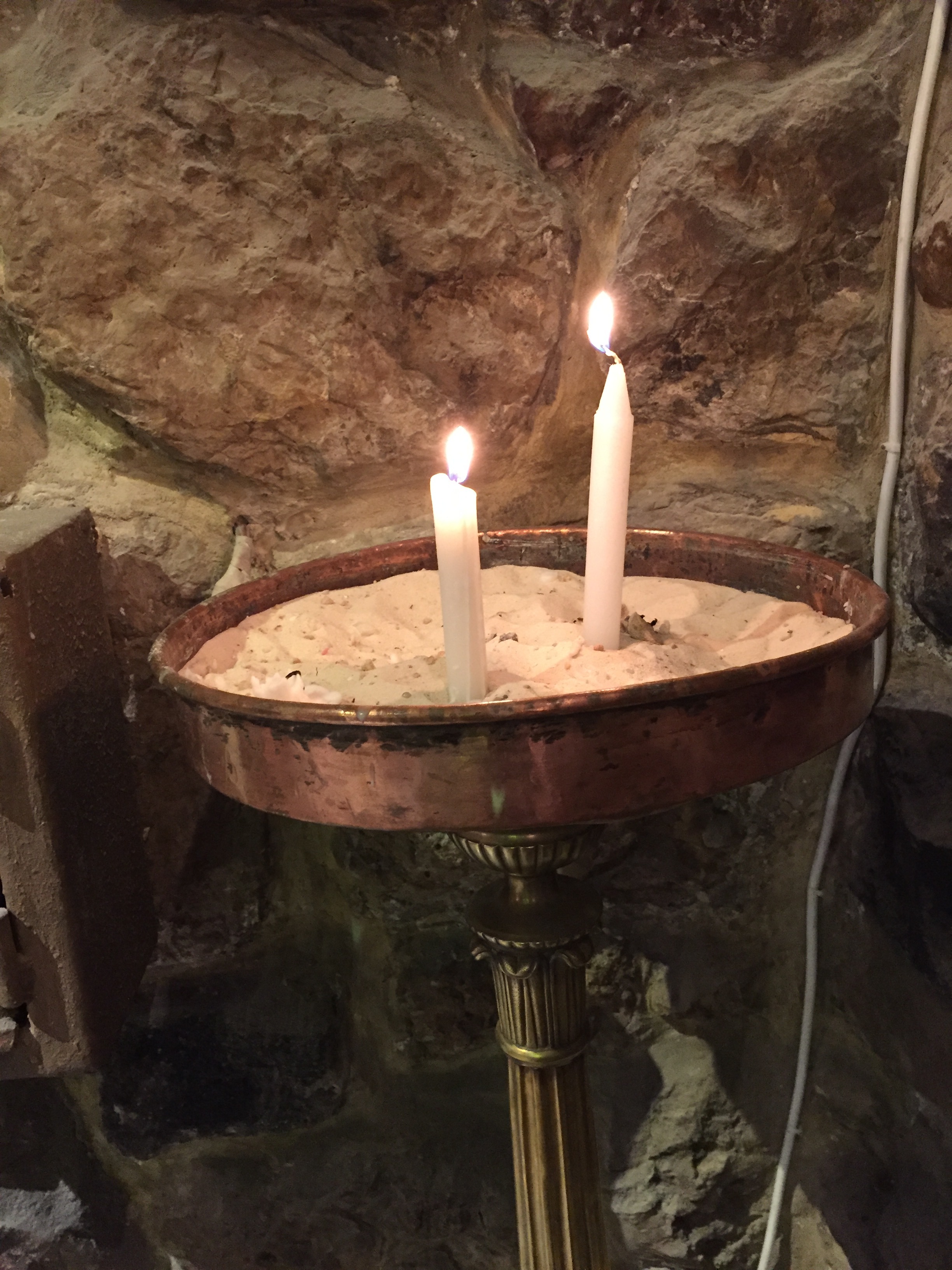  Lighting a candle of peace in the Ananias Chapel where tradition says Saul was baptized as Paul 