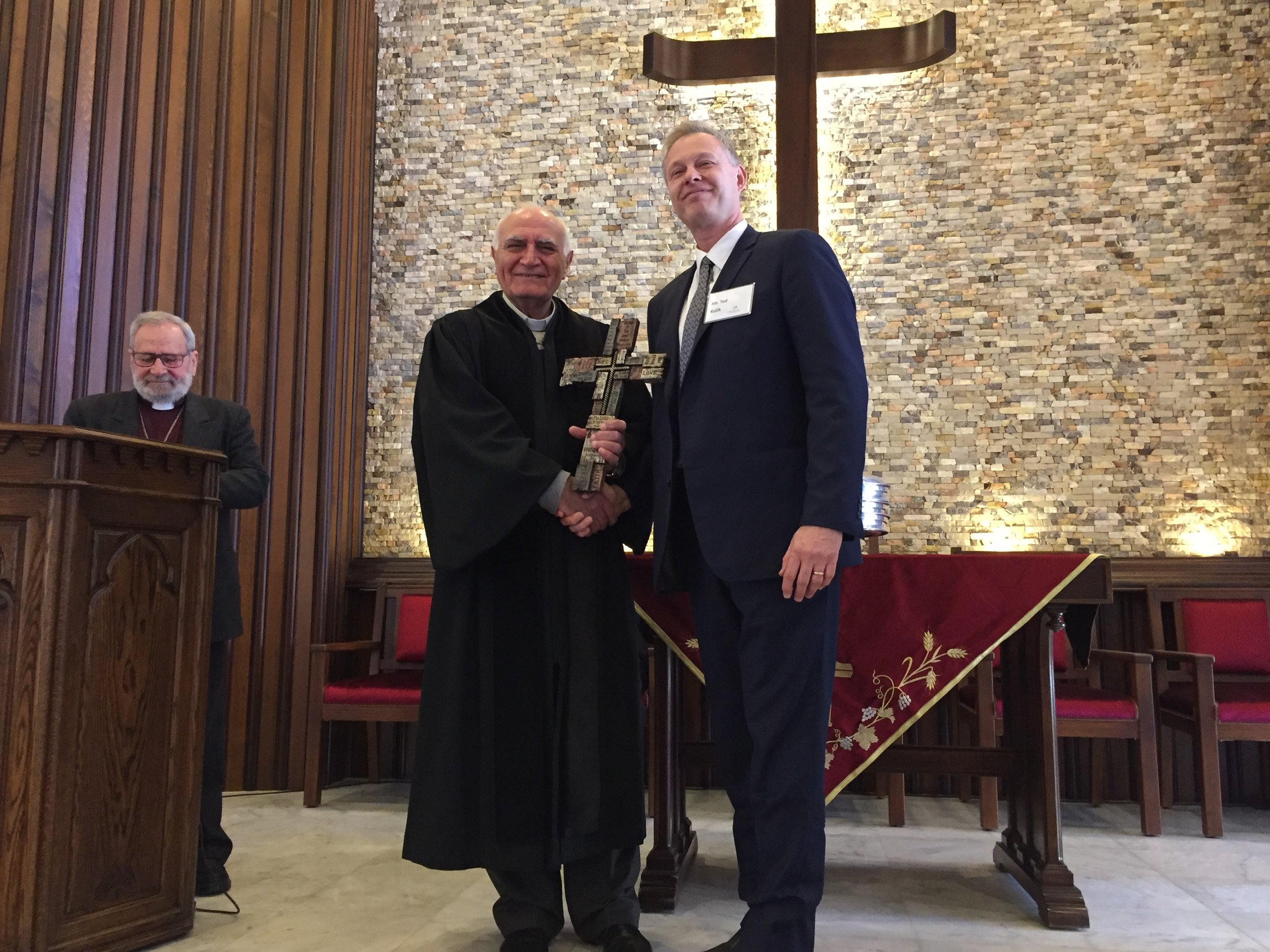  Ted Kulik presents the gift of a cross to Homs church pastor Rev. Yousef Jabbour 
