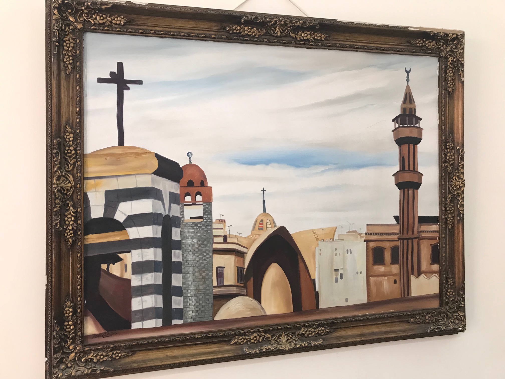  Painting in the Homs church fellowship hall showing the Presbyterian church bell tower, Greek Catholic church, and two mosques 