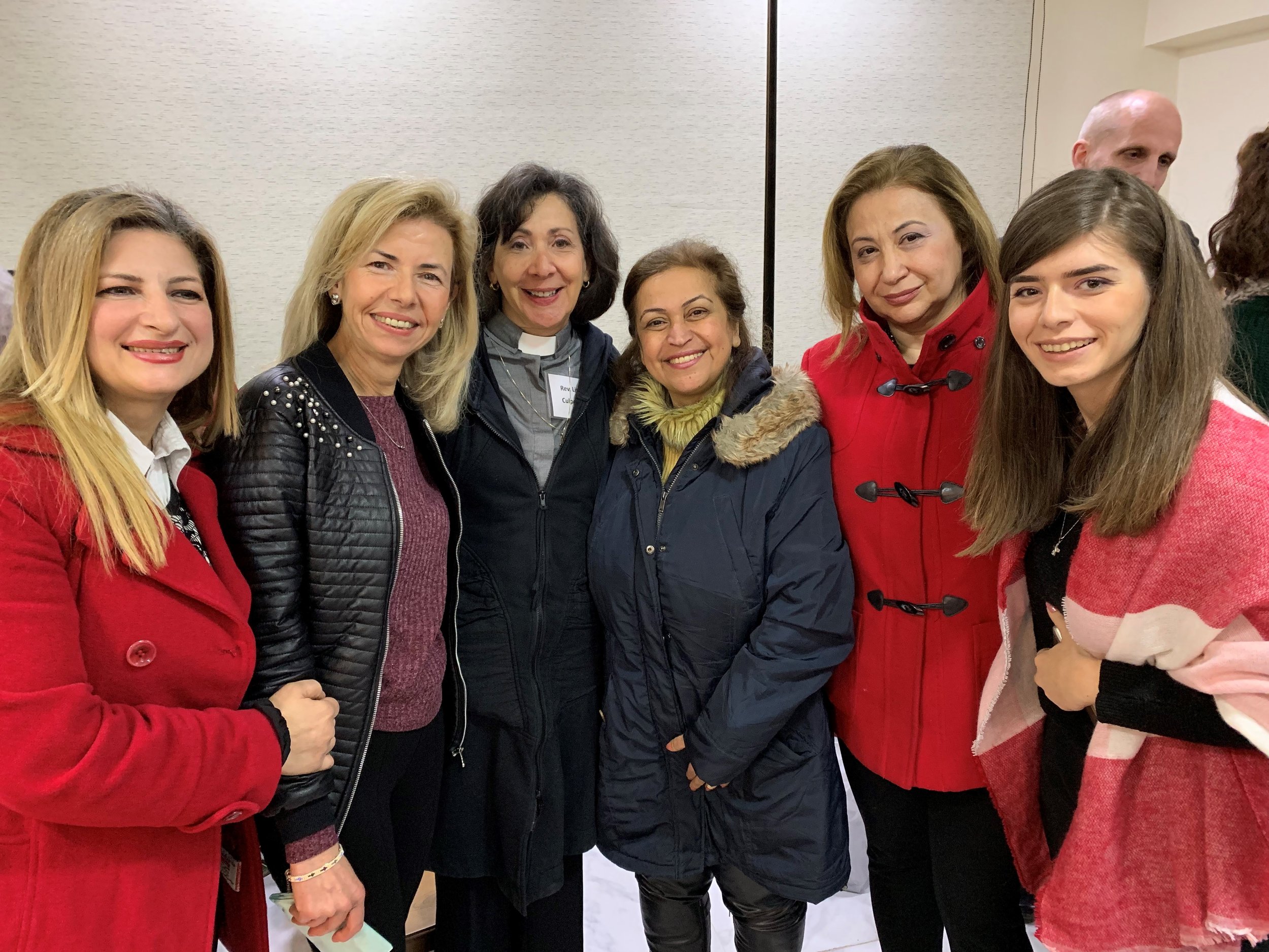  Third from the left (in clerical collar) Lisa stands between Salwa (second from left) and Lina (third from right) 