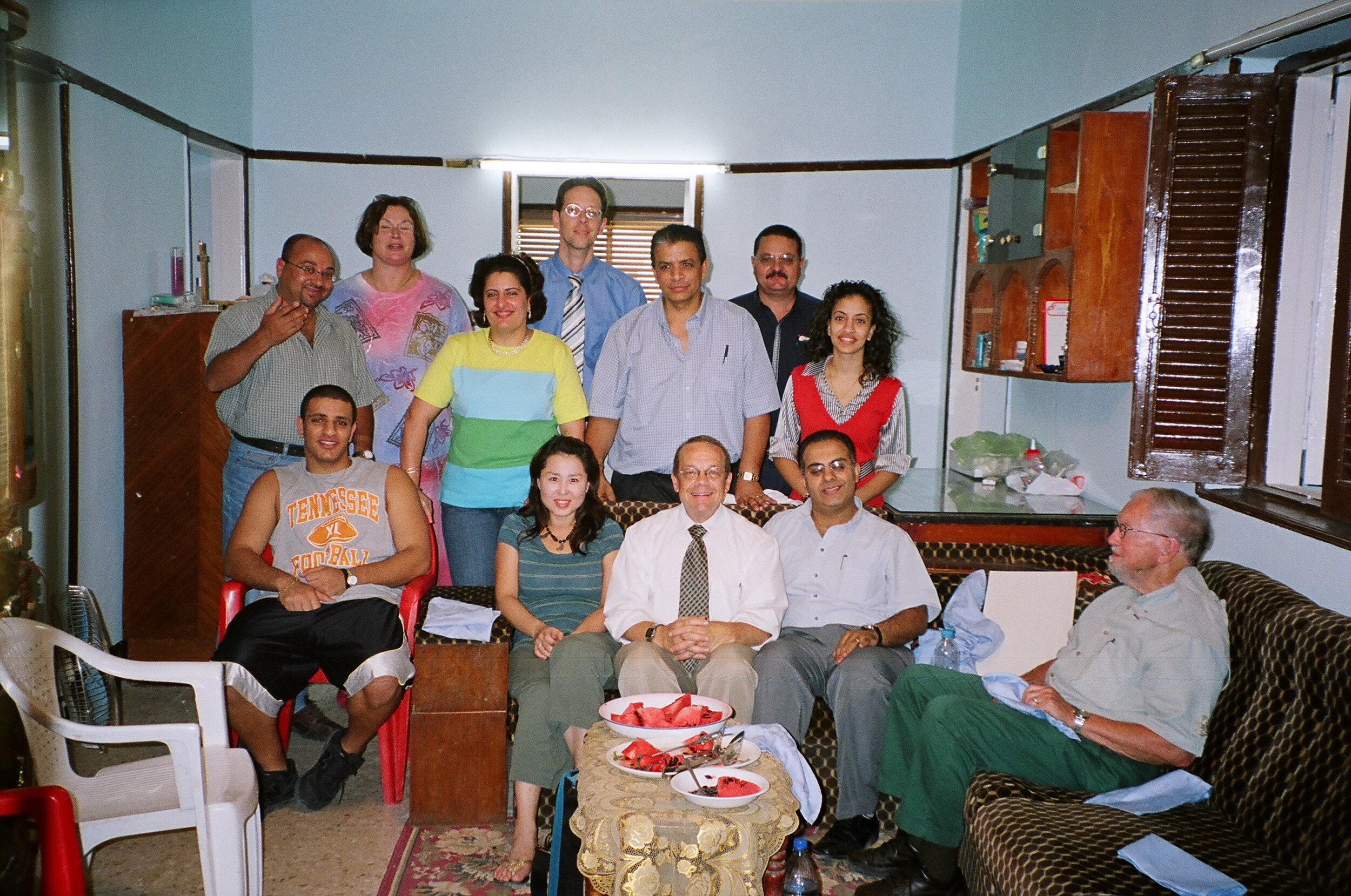  Amal and Ishak Abdelnour, standing in middle with two of their children on either side of them, as they welcome an Outreach delegation to their hometown of Tayyaba in 2007  