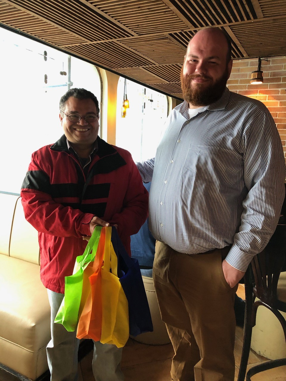  Ken presents Pastor Ibrahim with bags of small gifts for Abou Soliman Fellowship's children’s ministry 