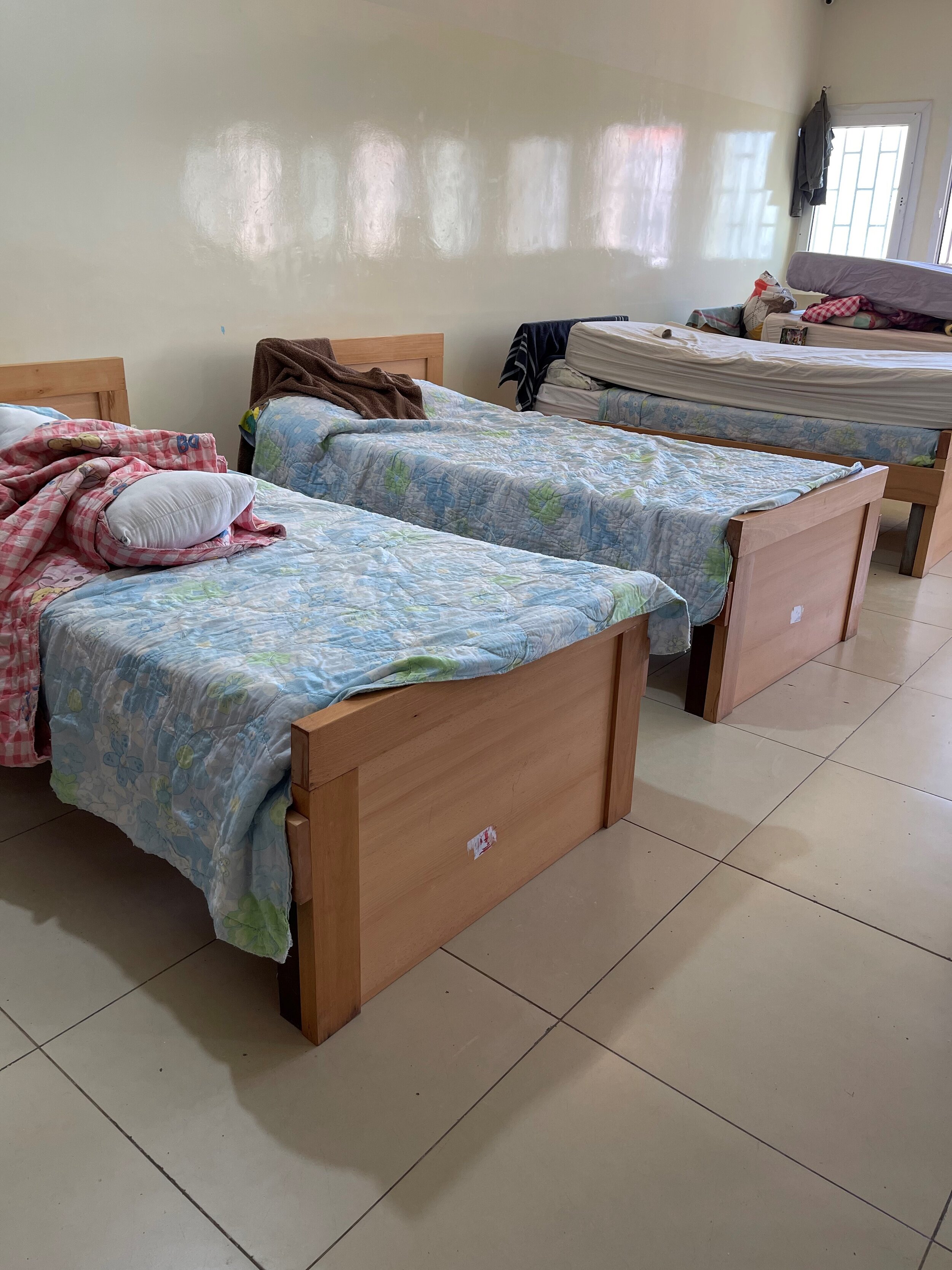   The children sometimes act out their emotional upheaval in destructive ways such as breaking their beds. These new ones (which Outreach helped to secure) have fared well – the staff encouraged each child to help build their own with the carpenter a