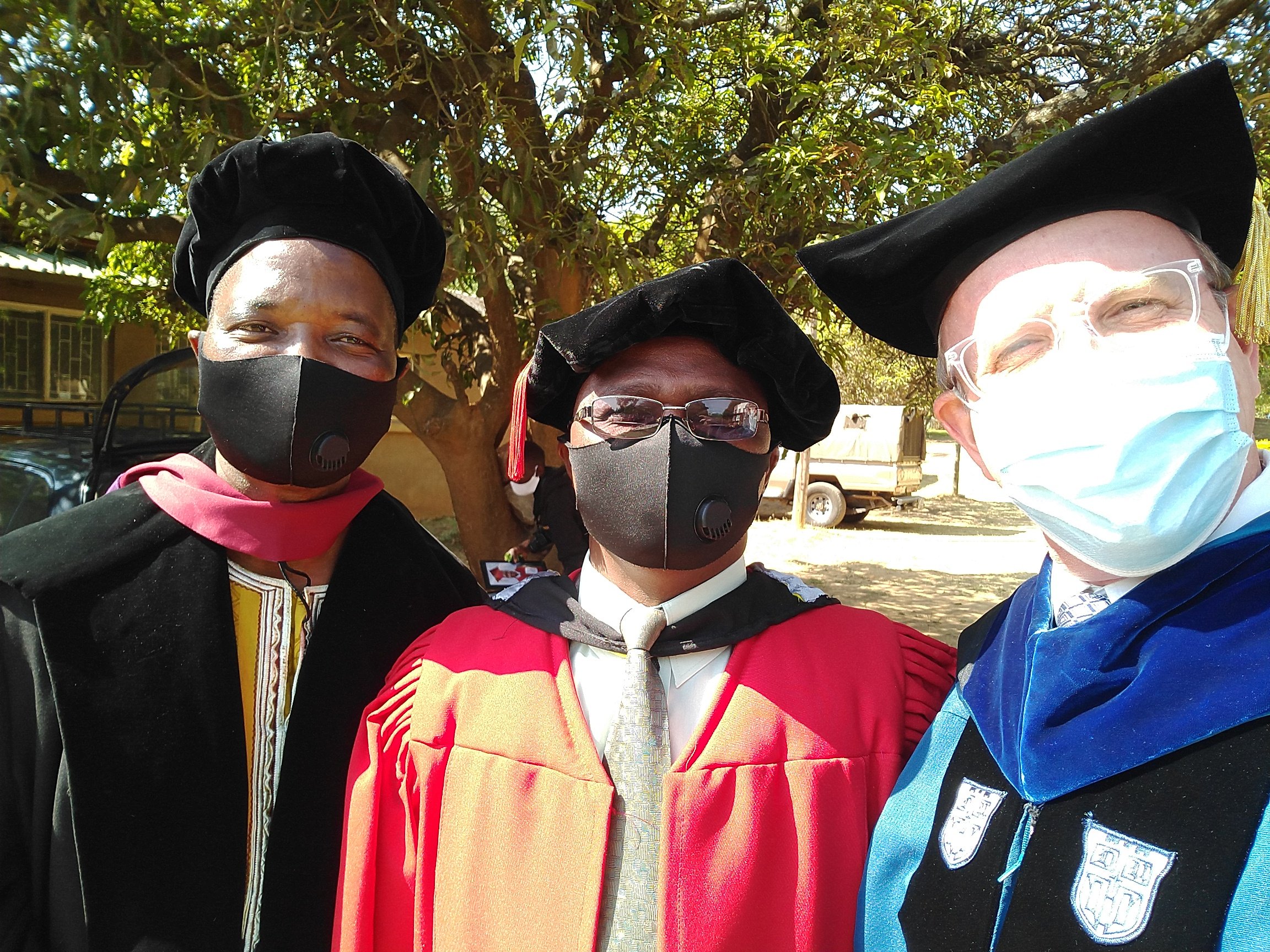 Professors DT Banda, Lameck Banda, and Dustin before entering the graduation ceremony