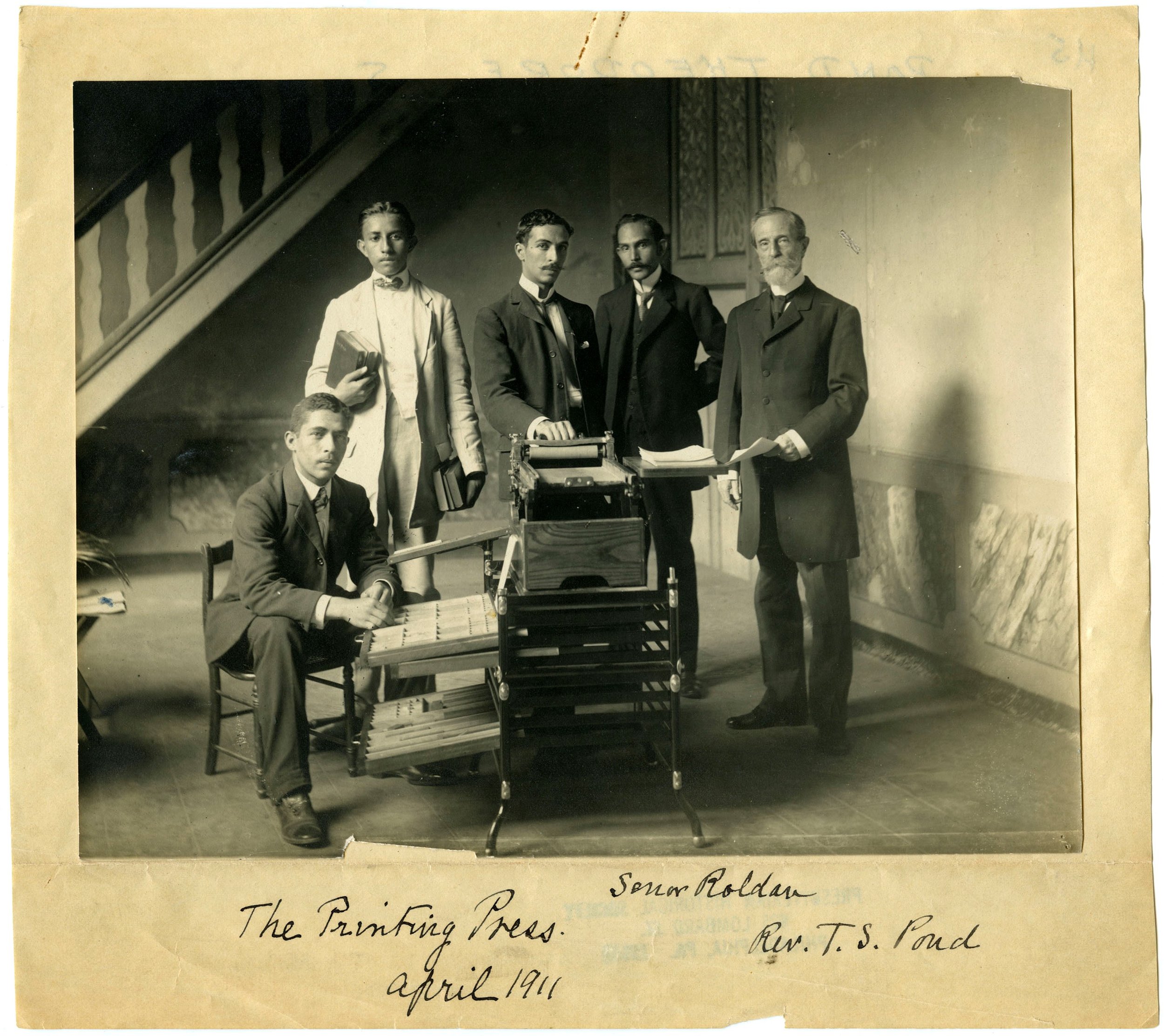 Rev. Pond (far right) with local church leaders and printing press, 1911