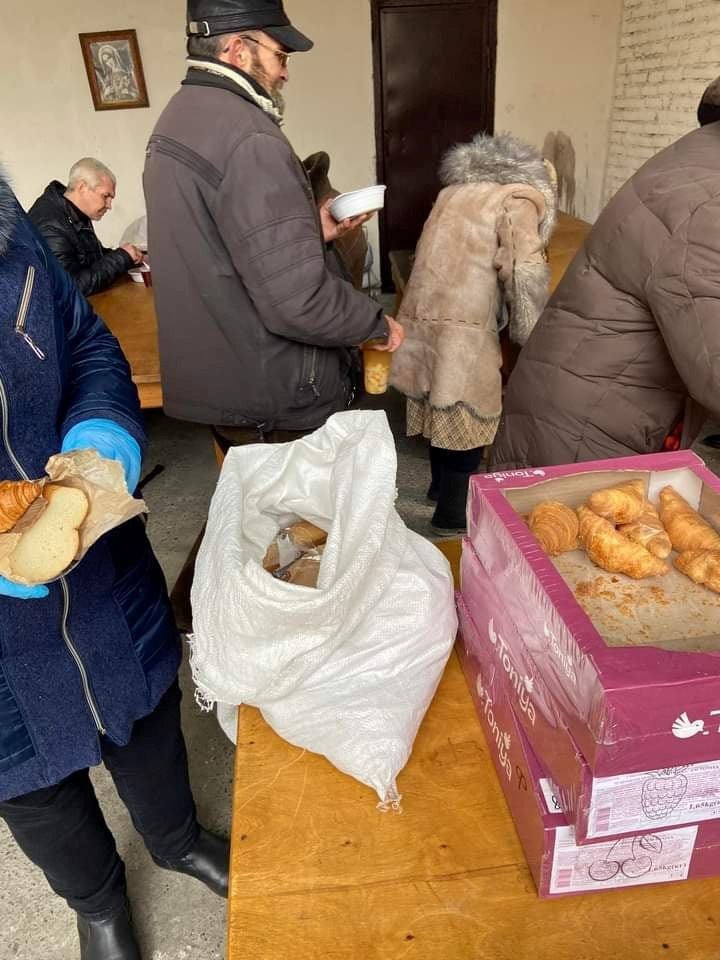 People in line to receive food at the church