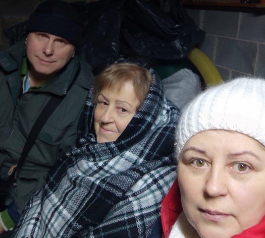  Sergii, Nataliya and Evgeniya huddle with others in a cellar 