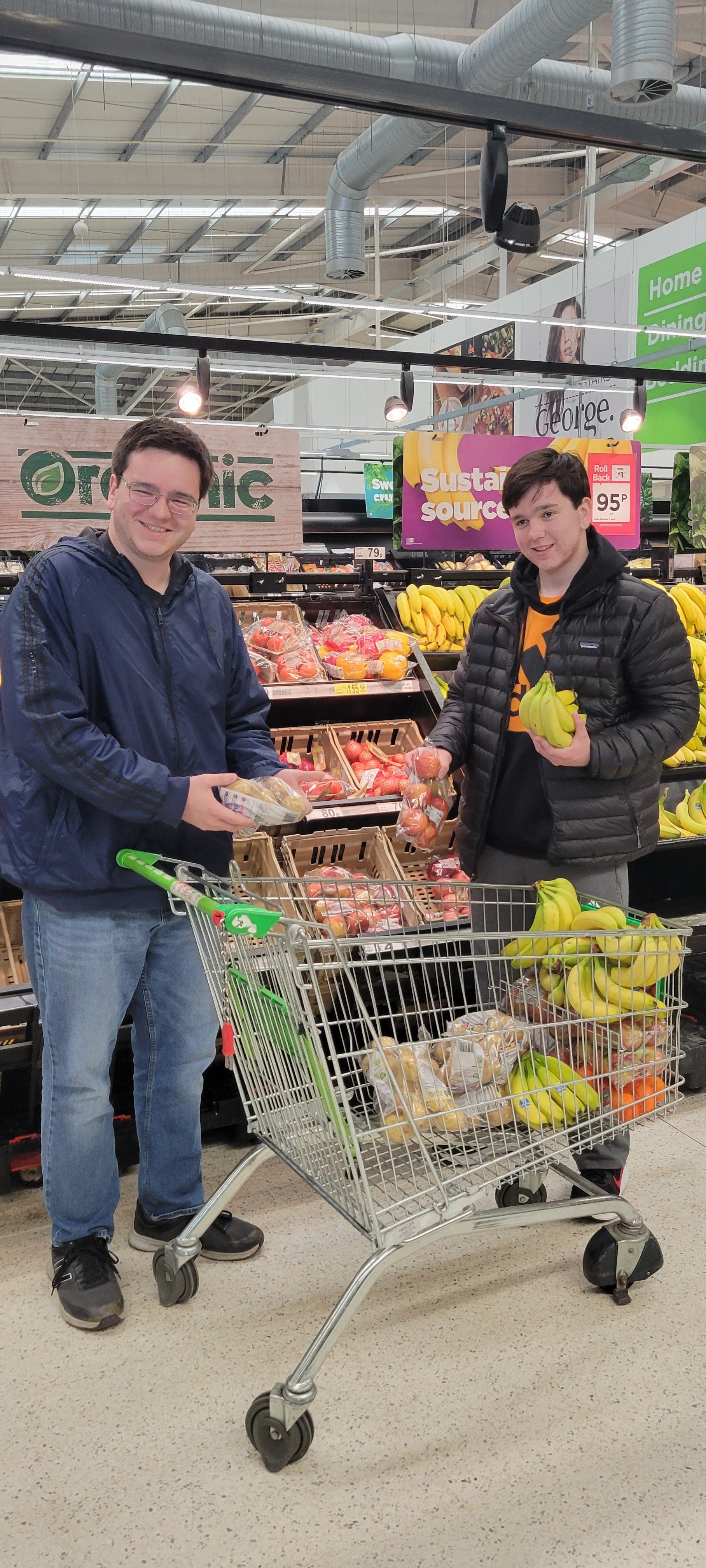 Luke and Anderson Chaney shopping for food to give to refugees