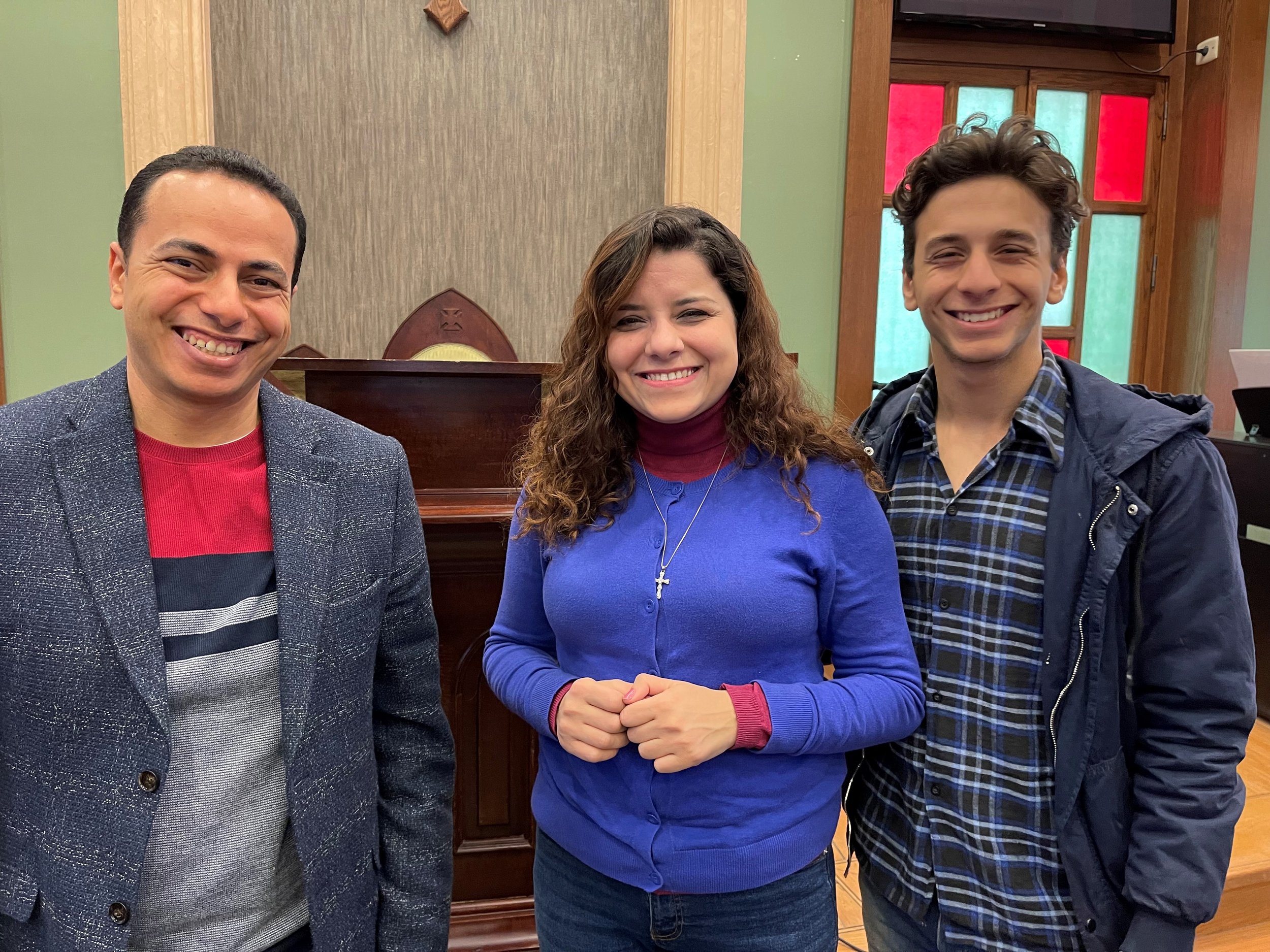 Professor John Samy (left) with student Sara Nosir and her brother, Nabil