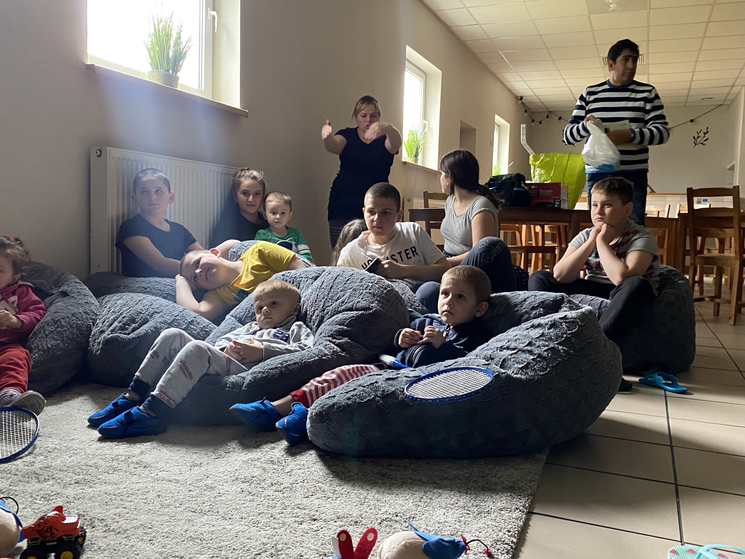 Children watch a movie in the tv area