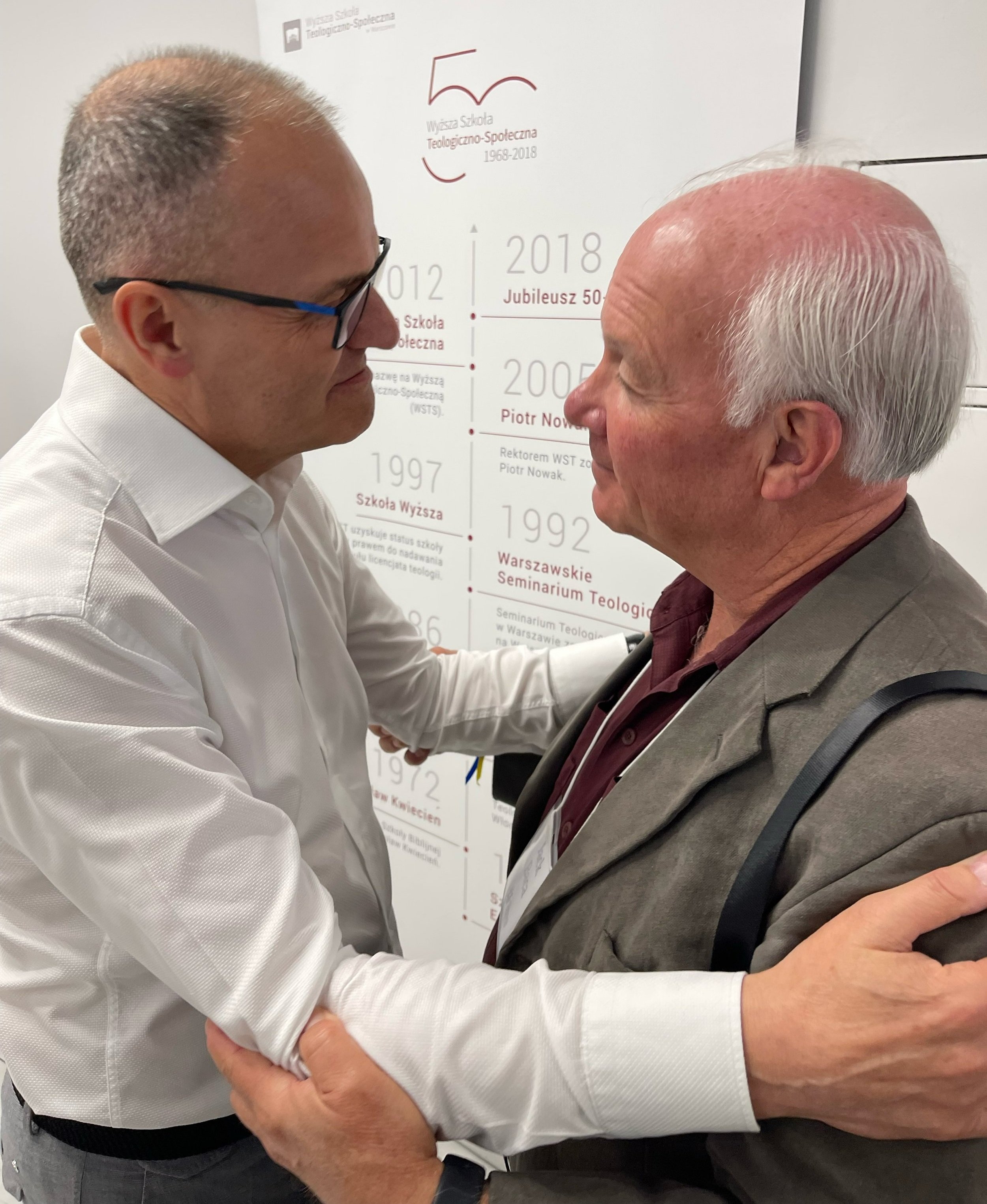   The Outreach Foundation board chair, Jack Baca, visits with Dr. Piotr Nowak, the president of the College of Theology and Social Sciences (Warsaw, Poland)  