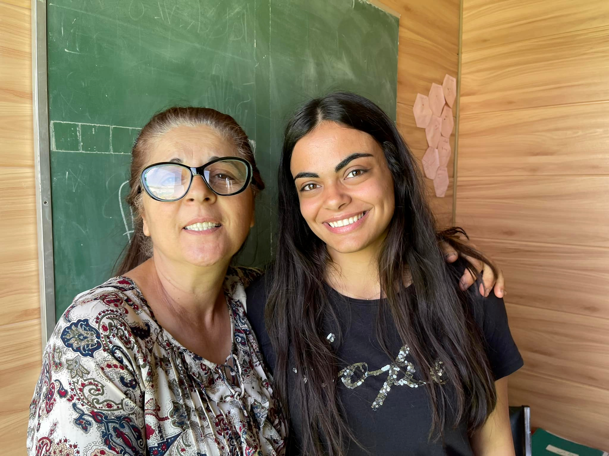  Izdihar, left,  with one of her radiant teachers who works with refugee children who have never had the opportunity to go to school