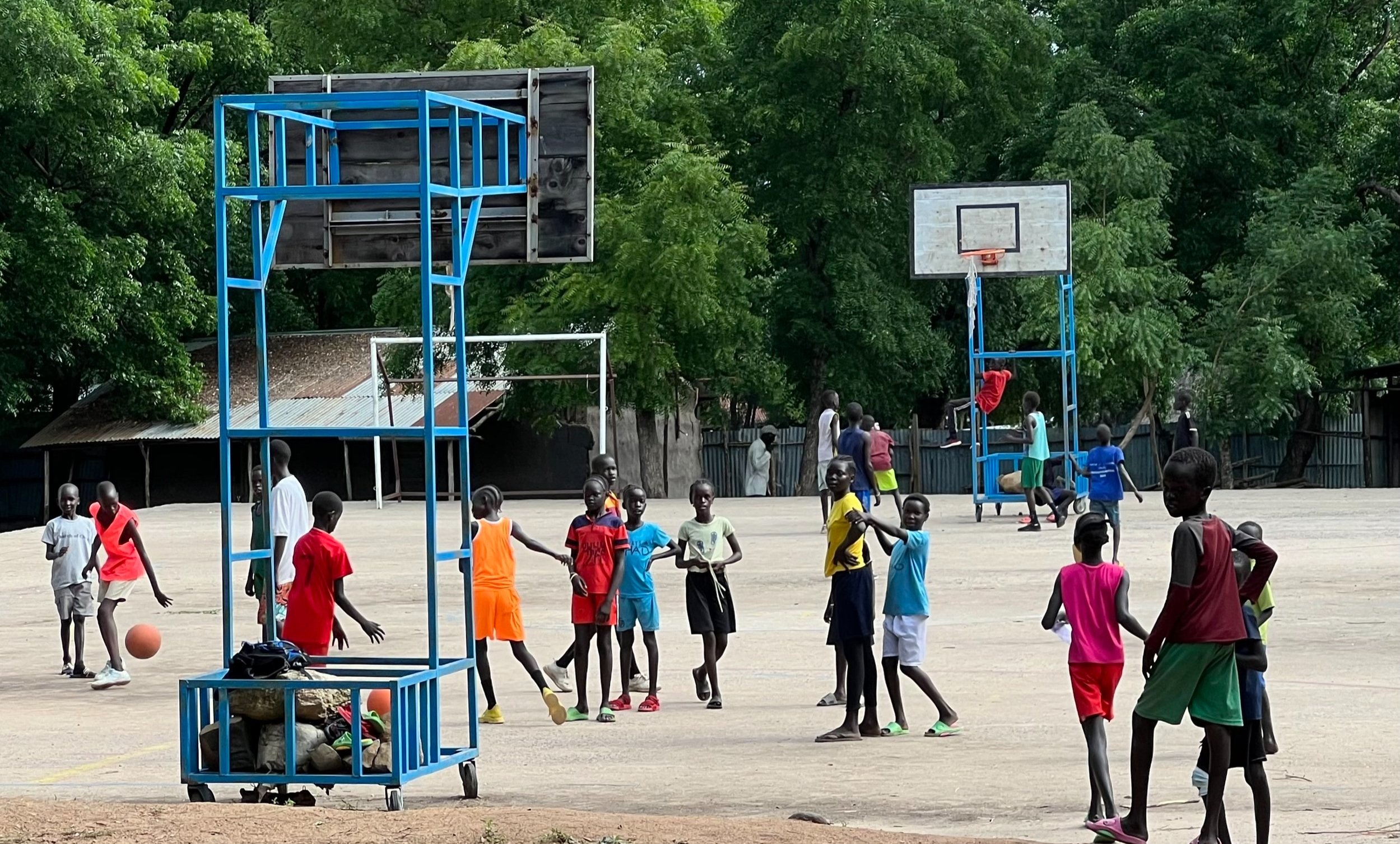  2 Children practicing Basketball on the church compound (waiting for the NBA scouts) 