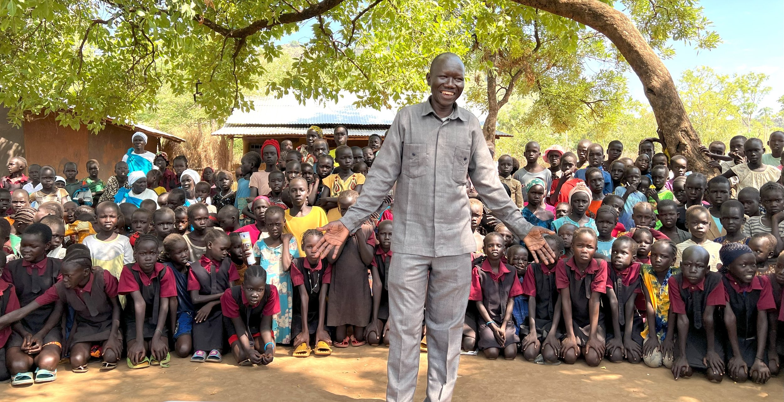  John Jock Gatwech with children in one of the refugee camps in Gambella 