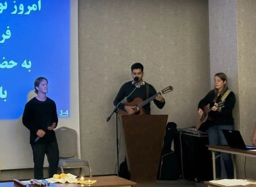 Josh Montoya and Hilary Ritchie lead in worship with Radmard