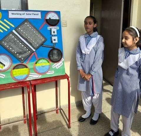  Grade 5 and 6 girls sharing their work on solar panels with us 