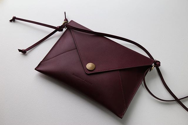 The envelope clutch in plum with a removable strap. American tanned Horween leather, solid brass hardware. Built and guaranteed to last a lifetime. Link in profile.