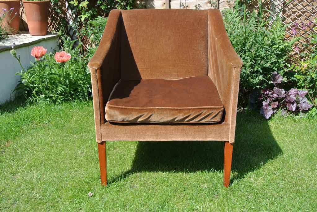  1960s armchair - stuffing has disintegrated in the arms and seat 