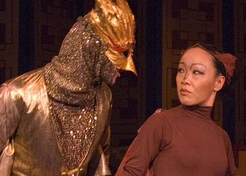 The Fake Nightingale (Mike Tran) sizes up his competition (Deedra Wong).