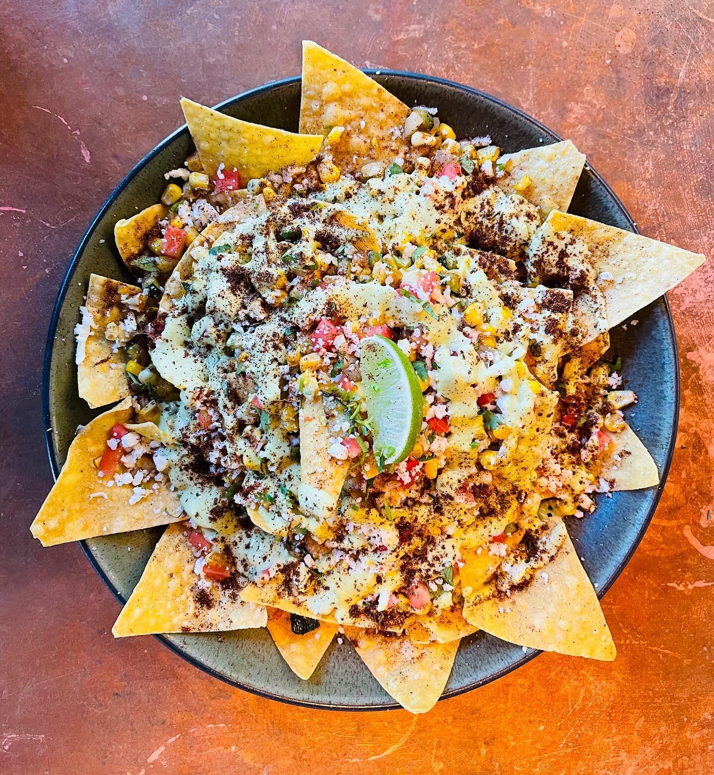 Elote Nachos have come to Tomatillo! Two fan favorites on one shareable plate. Get them this week 🌽