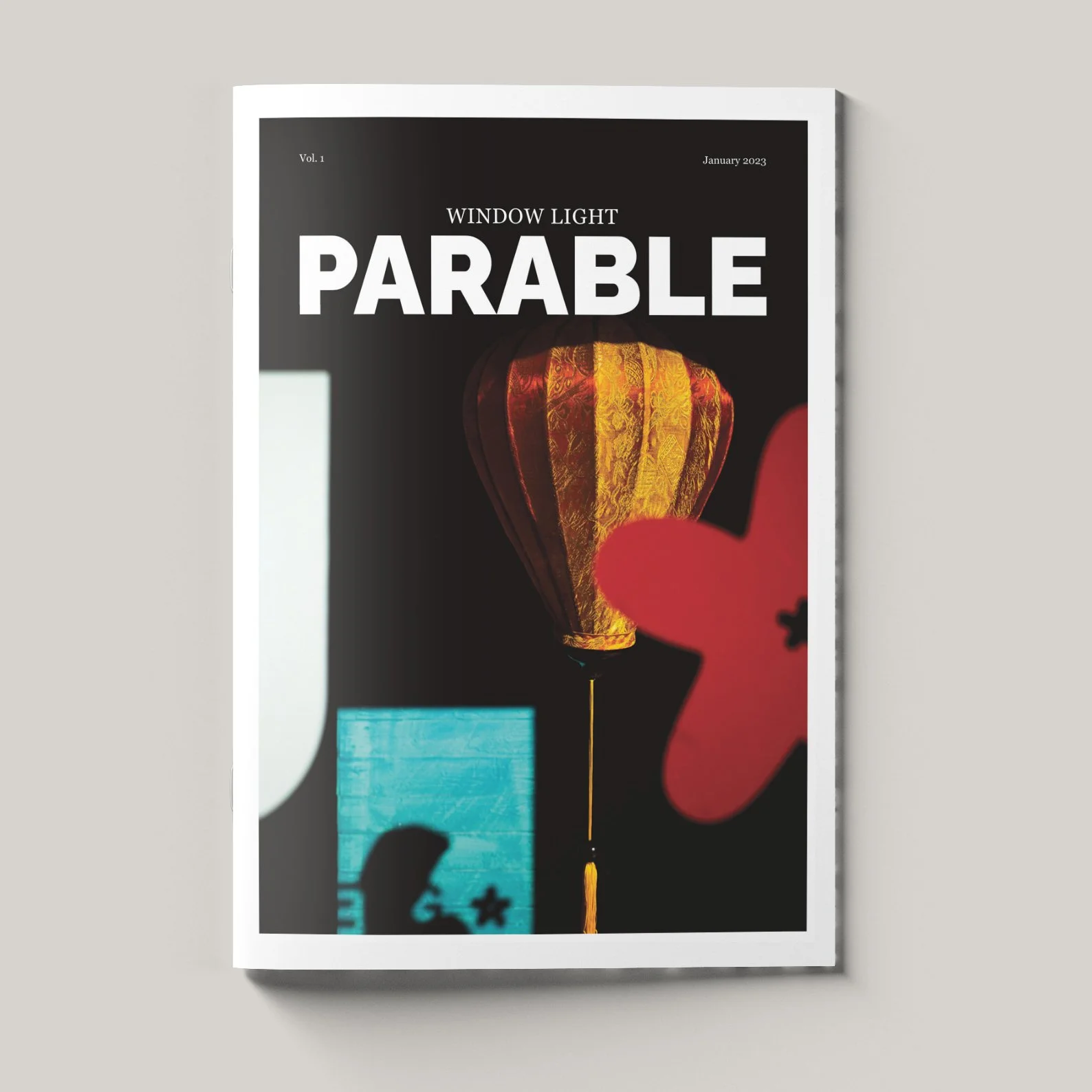 Magazine cover titled "Parable" with a lit lantern and abstract shapes.