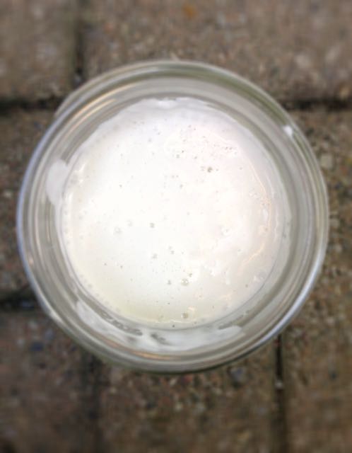 Bubbles rising up are a sign of fermentation, the taste will get tangier and tangier as it cultures