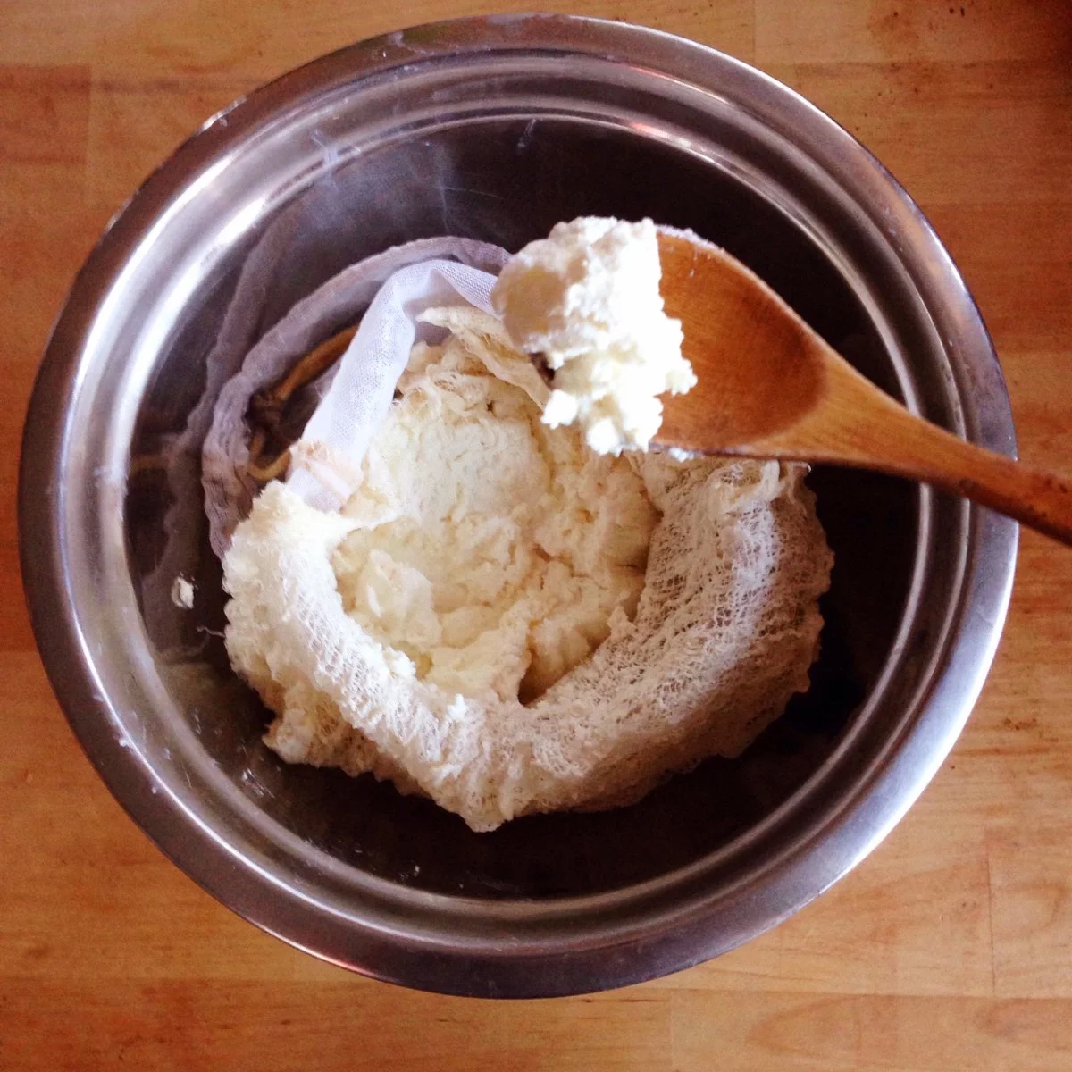 After 4 more hours of hanging with salt, the sheep cheese is thick with a cream cheese texture