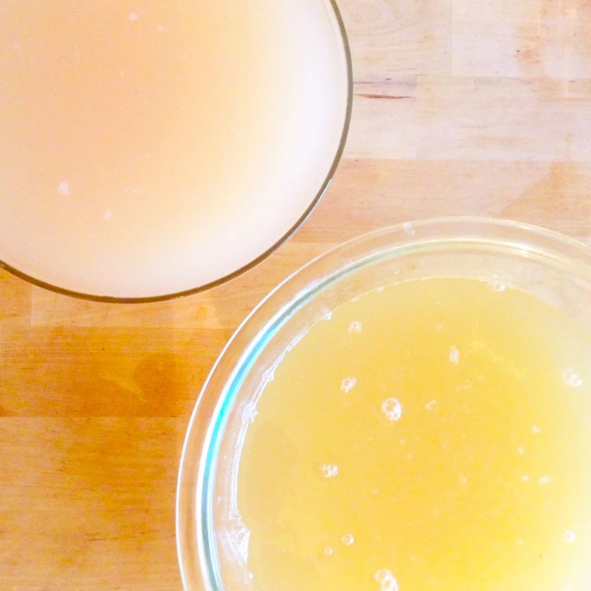 Gorgeous colours of peach and apple vinegar 1 week post-straining, you can see the layer of mother starting to form on top
