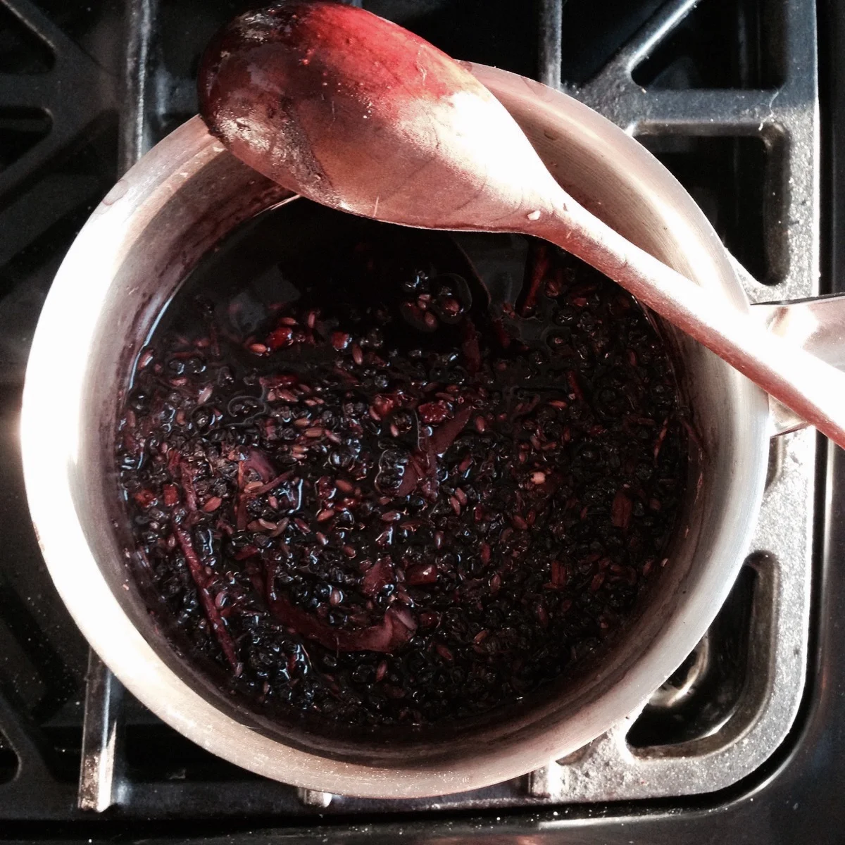 After cooking and reducing the liquid, notice how thickened the water is and how dark in colour