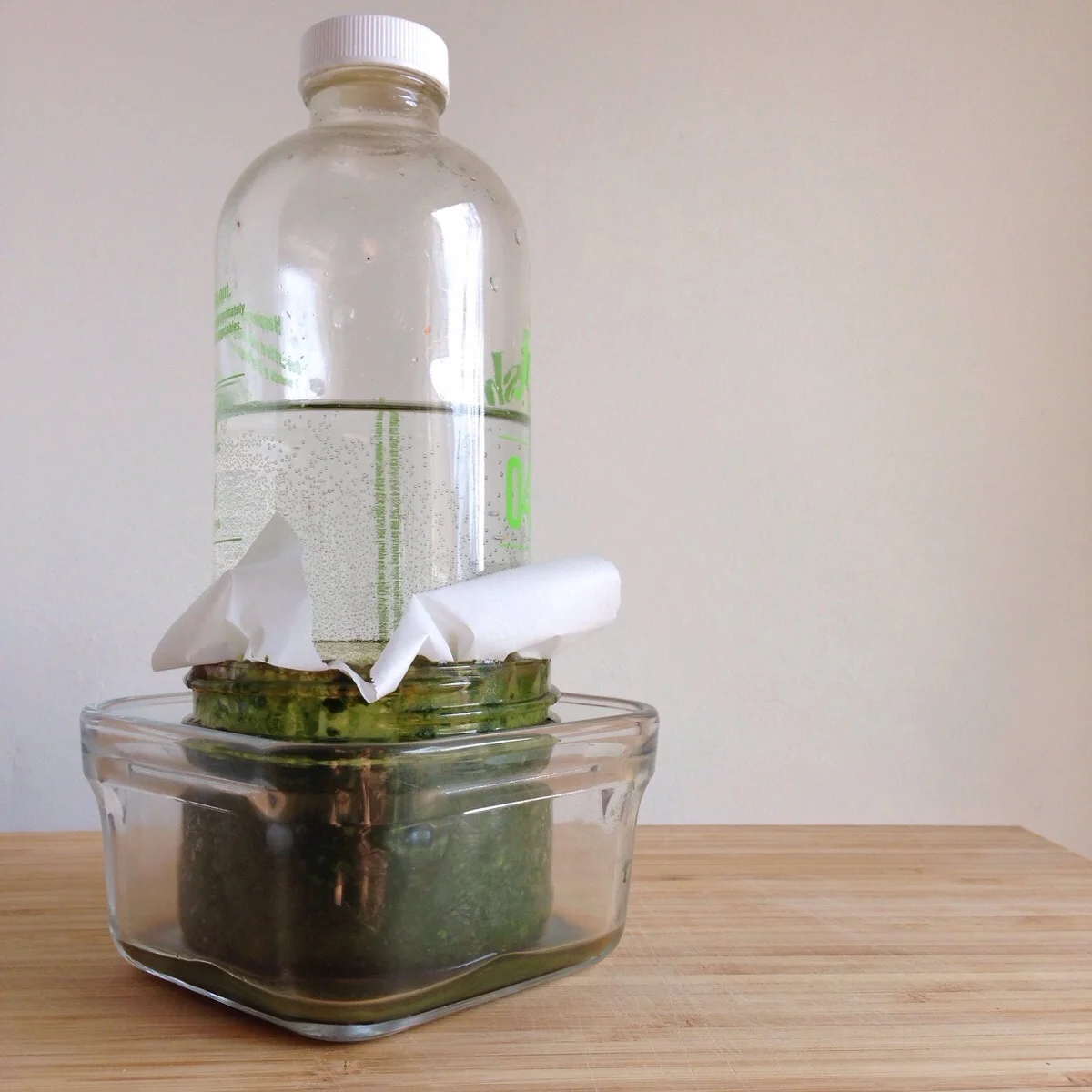 Place a weight on top to keep brine levels above herbs