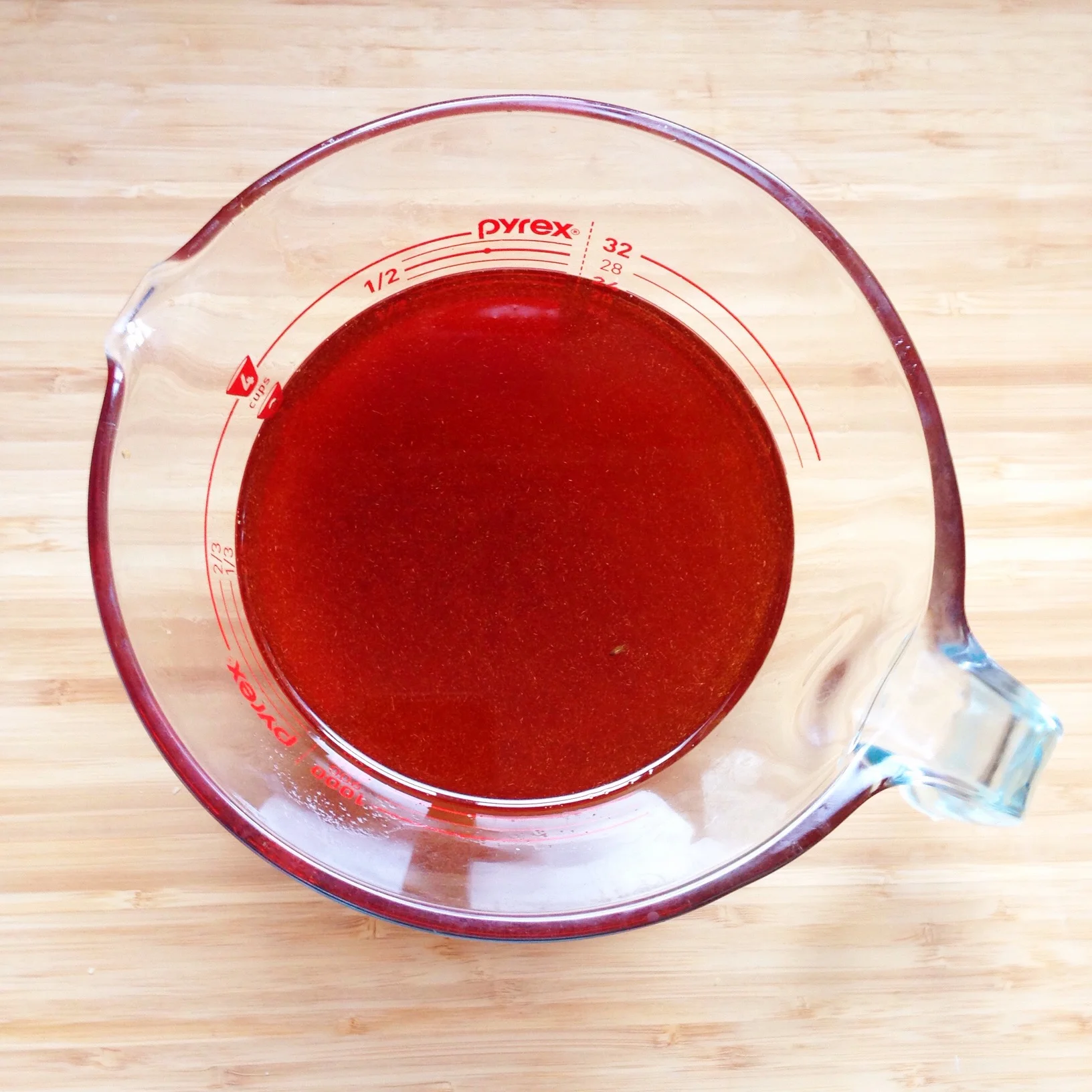 Such a beautiful red infusion from the chilis! You can also reserve some of this oil for a warming massage oil
