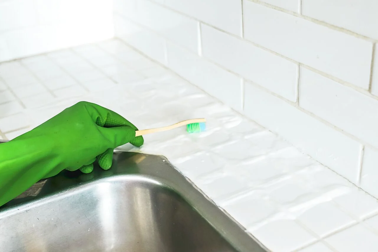 For stubborn stains, you can use an old toothbrush to scrub