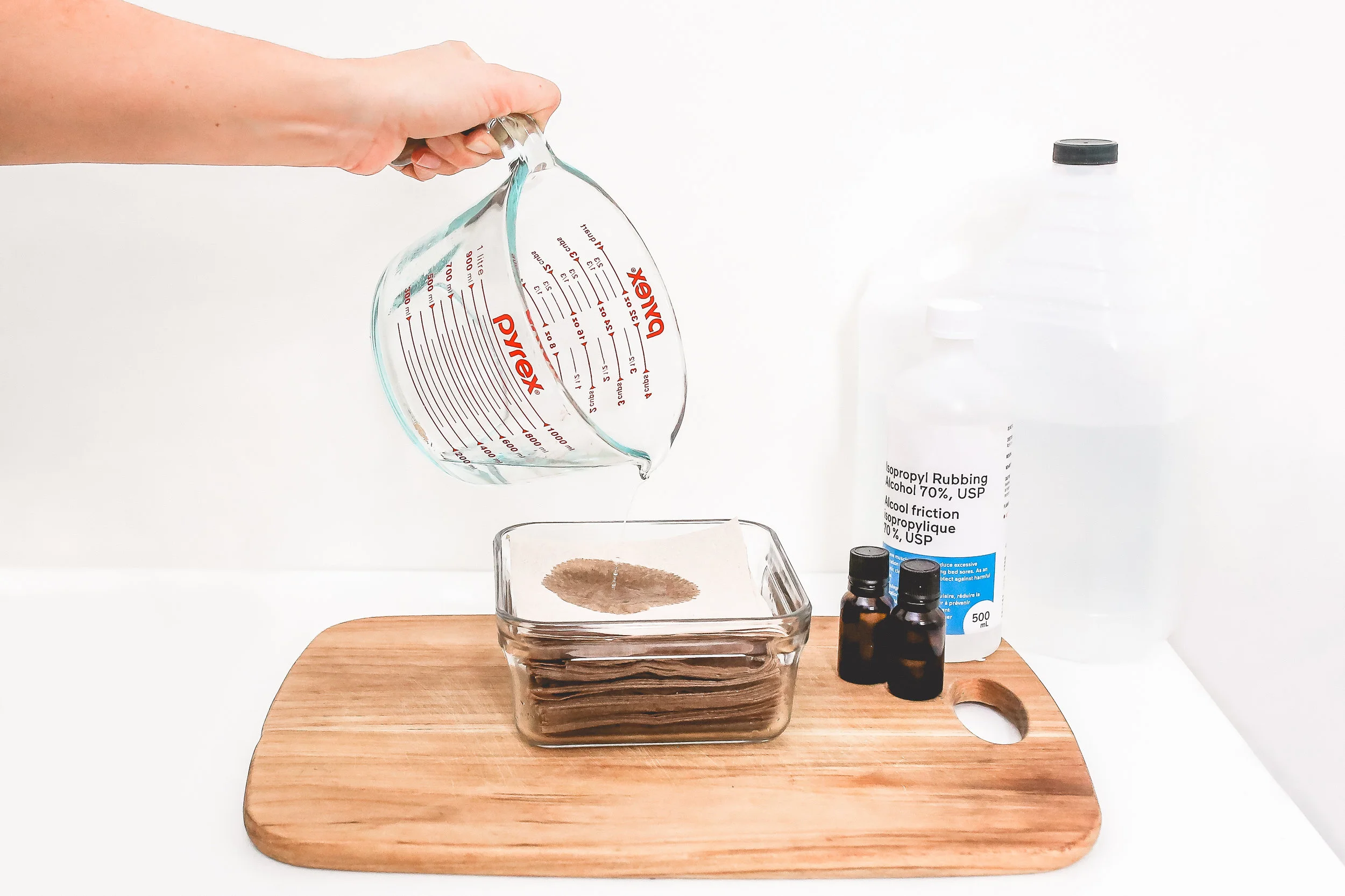 Pour the remaining liquid over the top of the napkins and seal container. If using cloth, simply pile into container and pour liquid over top and seal