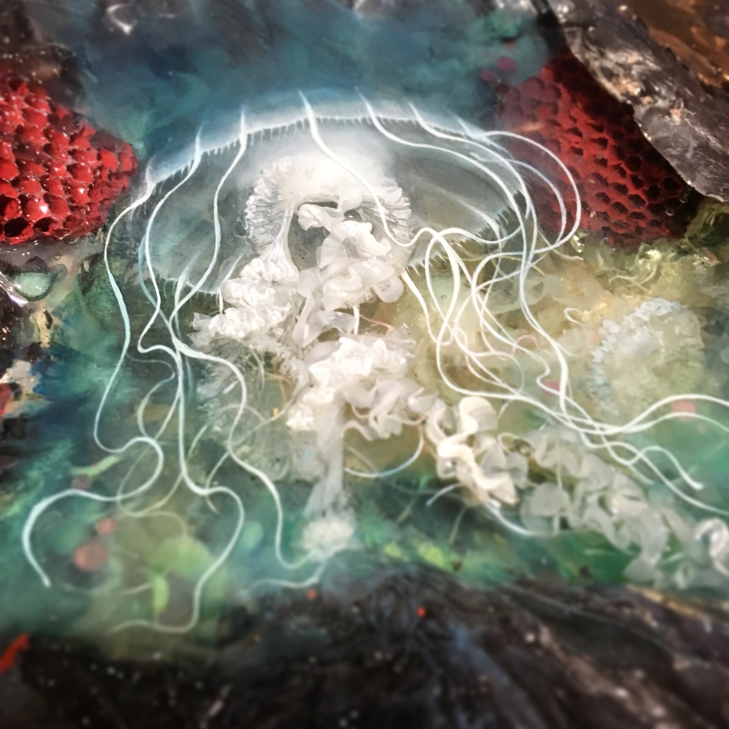  Omega contains five "pools" of resin that are my traditional layered paintings, full of natural artifacts such as coyote skulls, wasp nests, spiders, cicadas, and more.&nbsp; 