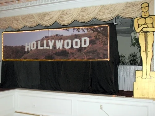 Hollywood Hills Banner:: self standing 8' tall and 12 feet wide. The sign measures 3' high and 12' wide. Surrounding the entire sign are rope lights. 