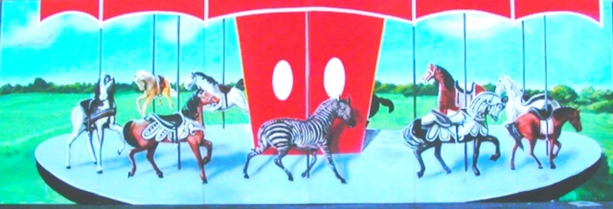 Carnival Carousel Scene: A nice piece with horses. Measures 8' tall and 24' wide, foamcore. It connects to the Roller Coaster Scene and The Hot Air Scene to form one continuous 140 foot wide piece.