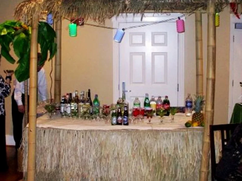 Tiki Hut: includes table, measures 8' high and 7' wide. Includes string lights.