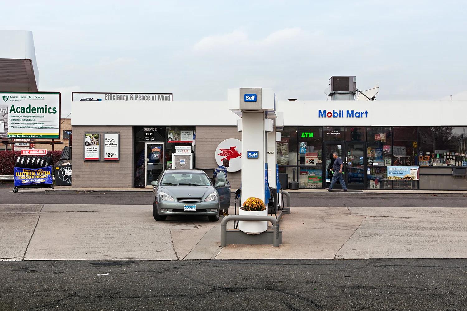 Mobil Mart. Amity Road, CT, 2010 Archival fiber inkjet print mounted to yellow sintra 32 x 48 inches
