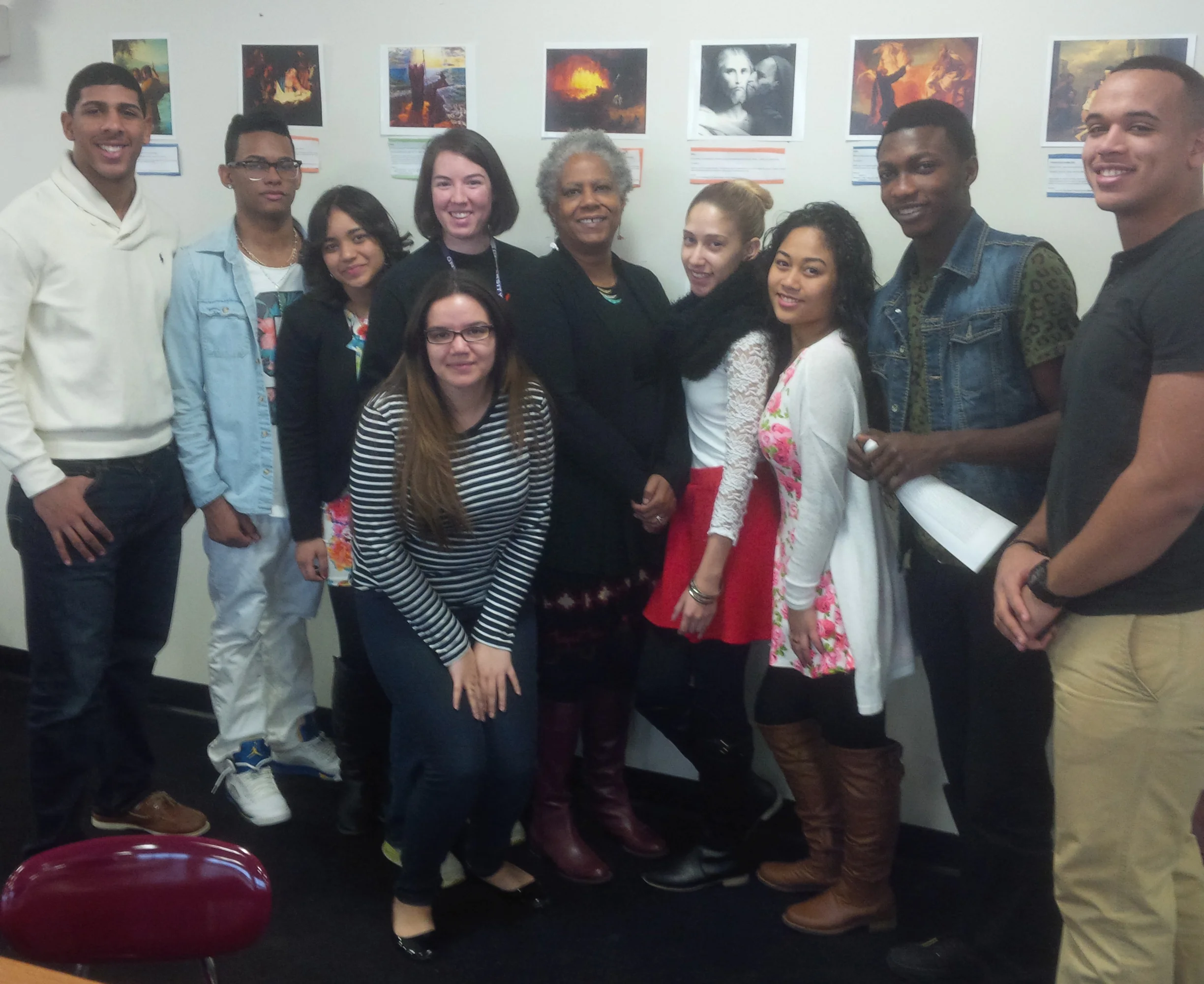 Alvarez Principal Zawadi Hawkins-Gladstone stands with Teacher Leader Beth Northup and seniors participating in Northup's" Allusion Studio"