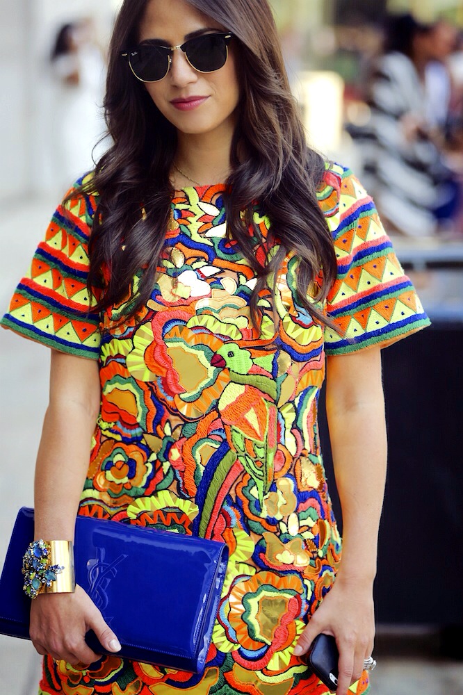 Sunglasses: Ray Ban, Dress: Pia Pauro, Clutch Saint Laurent via AMUZE , Cuff: Erickson Beamon Photo: Mangue Banzima