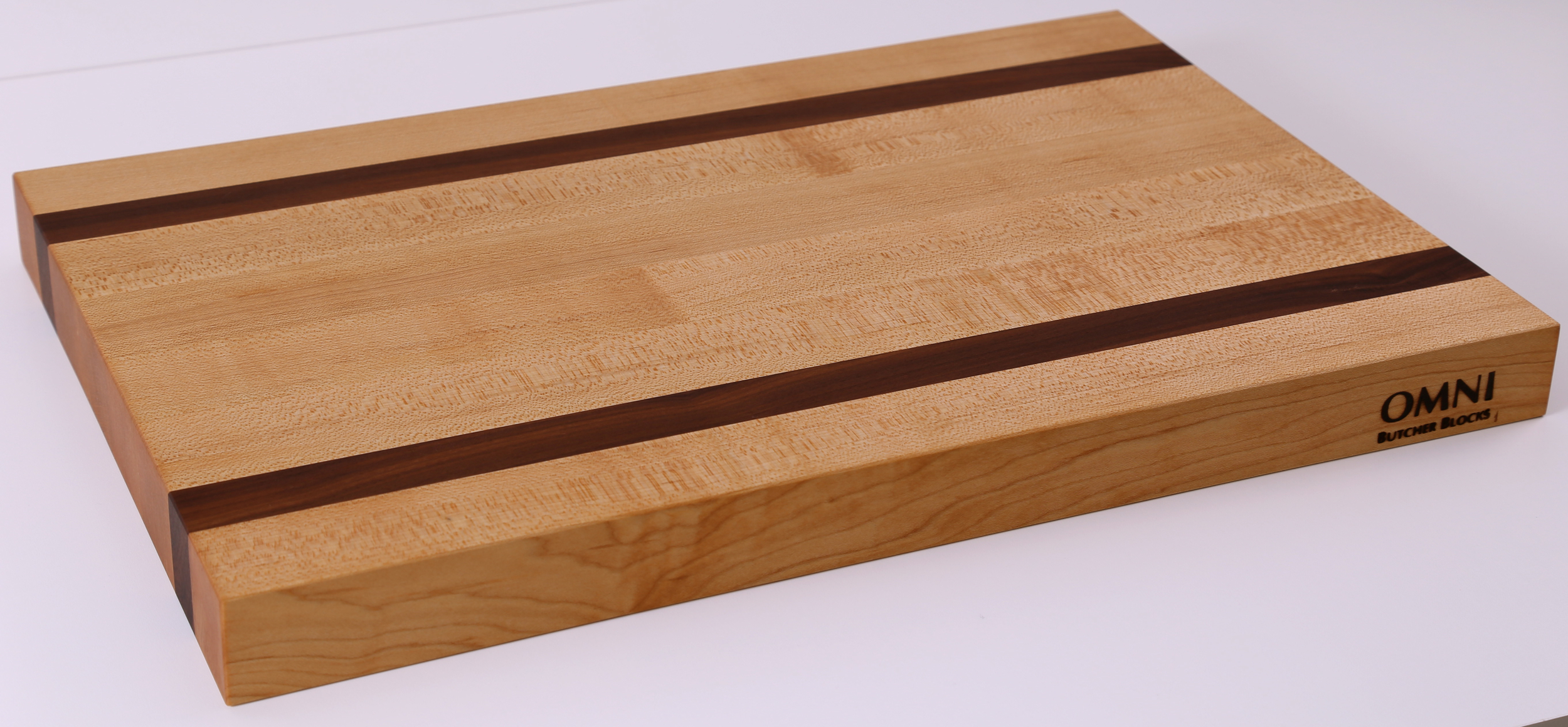 Our best selling edge grain cutting board is now available in wholesale! This board is perfect for all kitchen sizes and the walnut inlay adds elegance to an everyday kitchen tool. Approx. measurements are 18" x 12" x 1.5"